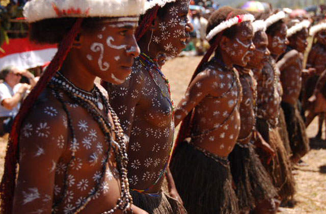 Baliem-Valley-Festival-Each-tribal-warriors-bring-their-own-supporters.-These-young-girls-dance-to-amplify-the-warring-spirit-in-the-staged-war-dance.